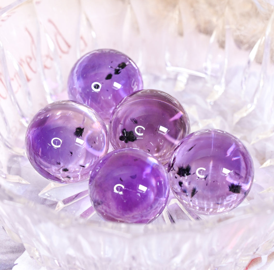AAA grade amethyst mini spheres with hollandite inclusions